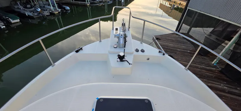 Jeanne Marie III Yacht Photos Pics Bow view of a 2003 Nordic Tug 42 at a marina dock.