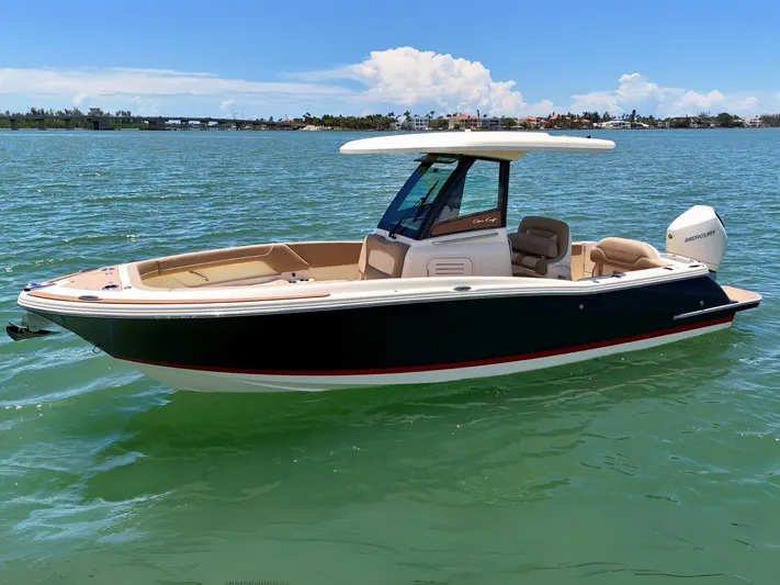  Yacht Photos Pics 2024 Chris-Craft Catalina 24 boat on calm water, showcasing sleek design and luxury features.