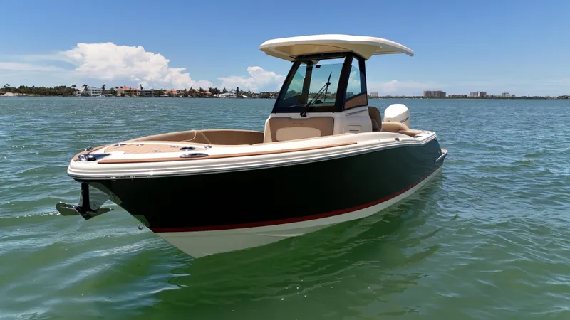  Yacht Photos Pics 2024 Chris-Craft Catalina 24 boat on calm water under clear blue sky.