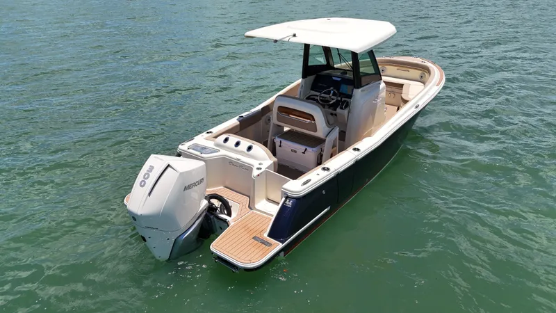  Yacht Photos Pics 2024 Chris-Craft Catalina 24 boat on water, featuring sleek design and powerful Mercury engine.