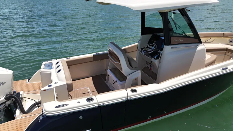  Yacht Photos Pics 2024 Chris-Craft Catalina 24 boat on water, featuring sleek design and modern amenities.