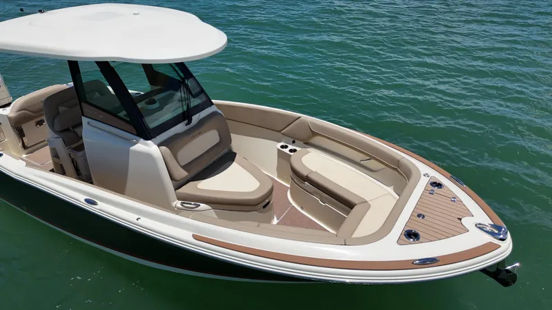  Yacht Photos Pics 2024 Chris-Craft Catalina 24 boat on water, featuring sleek design and spacious seating.