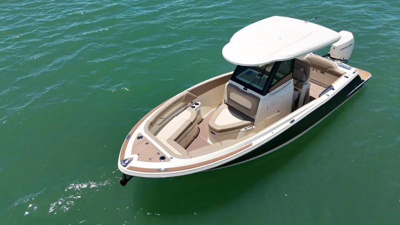  Yacht Photos Pics 2024 Chris-Craft Catalina 24 boat on clear water, showcasing sleek design and luxury features.