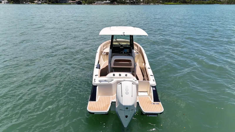  Yacht Photos Pics 2024 Chris-Craft Catalina 24 boat on calm water, rear view.