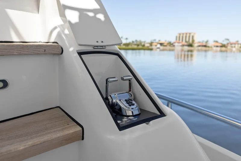  Yacht Photos Pics Lazzara yacht control panel with scenic waterfront view in the background.