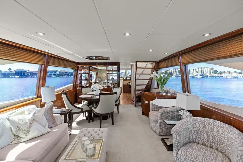  Yacht Photos Pics Luxurious Lazzara yacht interior with elegant seating, dining area, and panoramic water views.