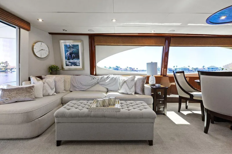  Yacht Photos Pics Luxurious Lazzara yacht interior with elegant seating, large windows, and stylish decor.