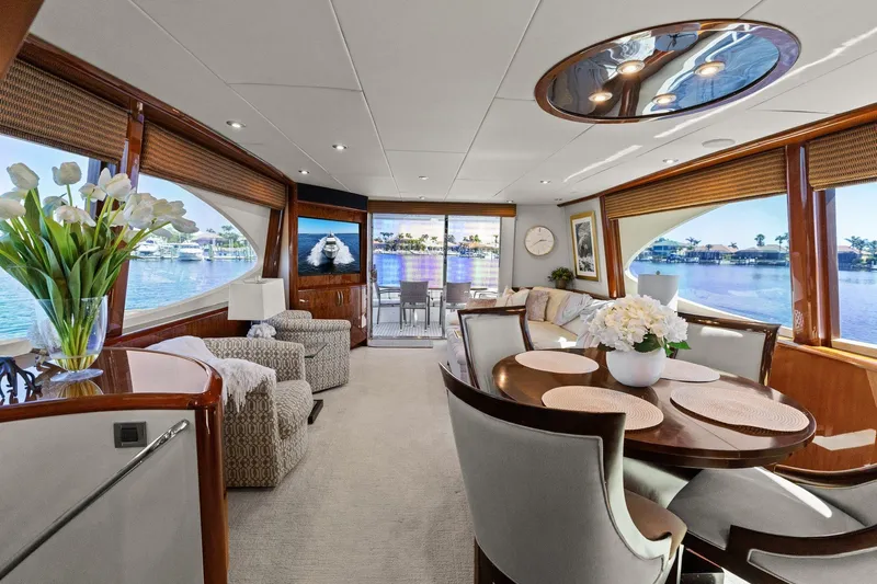  Yacht Photos Pics Luxurious Lazzara yacht interior with elegant dining area, plush seating, and scenic water views.