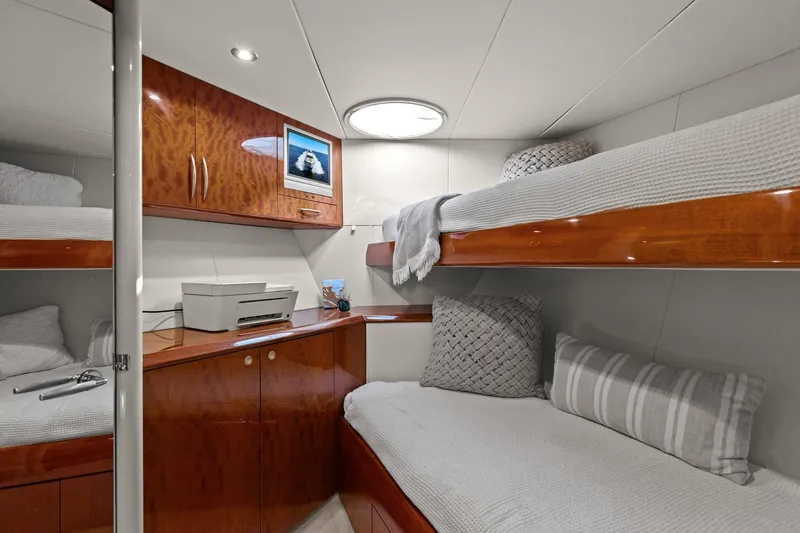  Yacht Photos Pics Luxurious Lazzara yacht cabin with wooden bunk beds and modern decor.