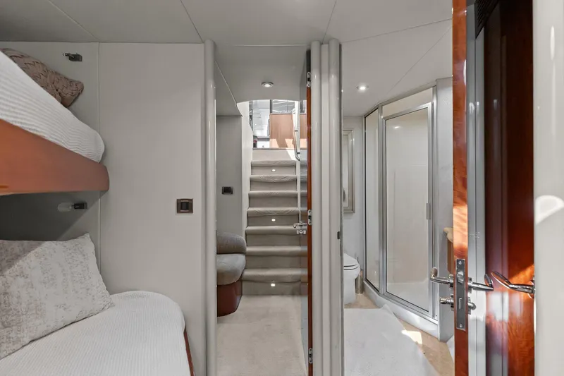  Yacht Photos Pics Luxurious Lazzara yacht interior with bunk beds, stairs, and modern bathroom.
