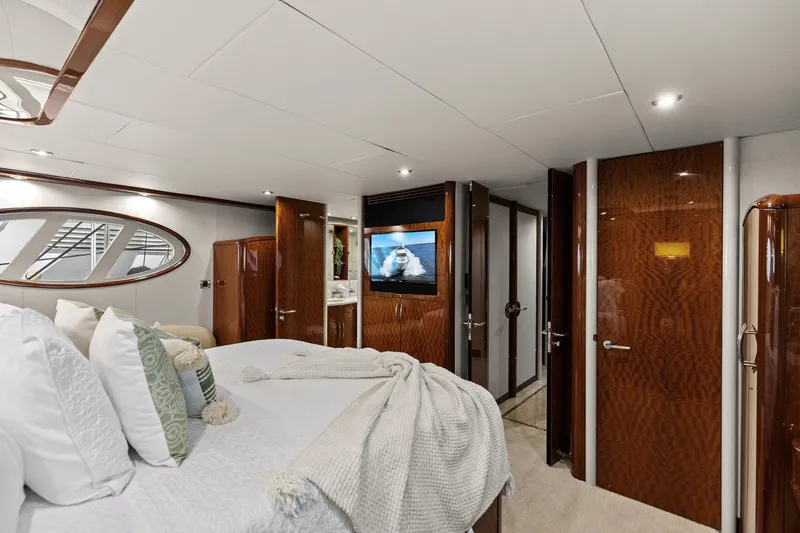 Yacht Photos Pics Luxurious Lazzara yacht bedroom with elegant wood finishes and modern decor.
