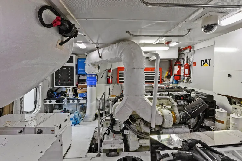  Yacht Photos Pics Engine room of a Lazzara yacht featuring CAT machinery and organized equipment.