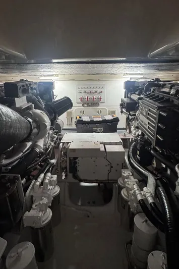  Yacht Photos Pics Engine room of 2004 Cabo 45 Express Los Suenos Edition, showcasing machinery and equipment.