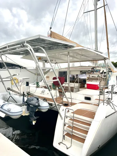  Yacht Photos Pics 2009 Lagoon 420 catamaran docked, featuring solar panels and a spacious deck.