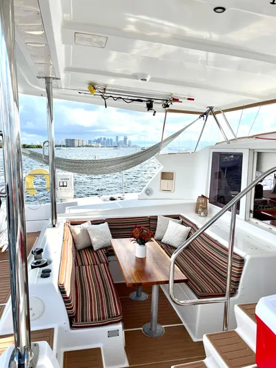  Yacht Photos Pics 2009 Lagoon 420 catamaran with outdoor seating, table, and ocean view.