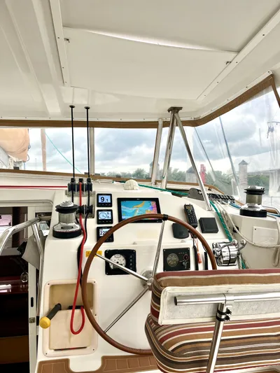  Yacht Photos Pics 2009 Lagoon 420 yacht cockpit with navigation instruments and steering wheel.