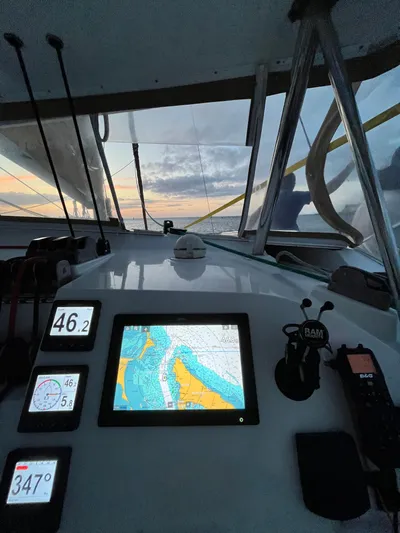  Yacht Photos Pics Lagoon 420 yacht cockpit with navigation screens at sunset, 2009 model.