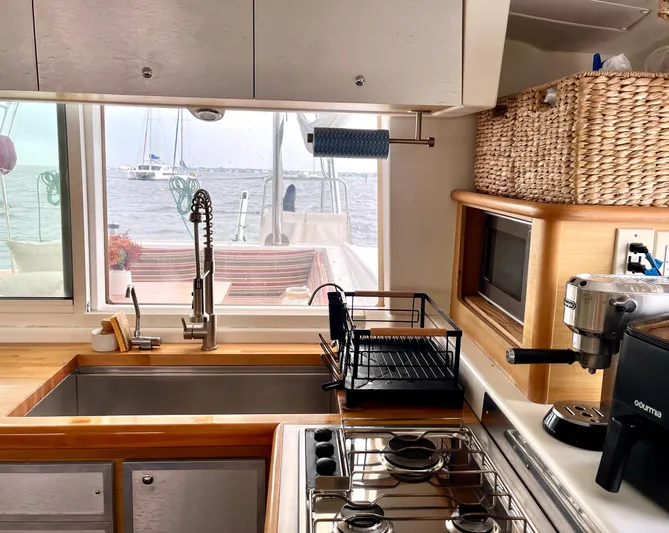  Yacht Photos Pics Modern kitchen interior of 2009 Lagoon 420 yacht with ocean view.