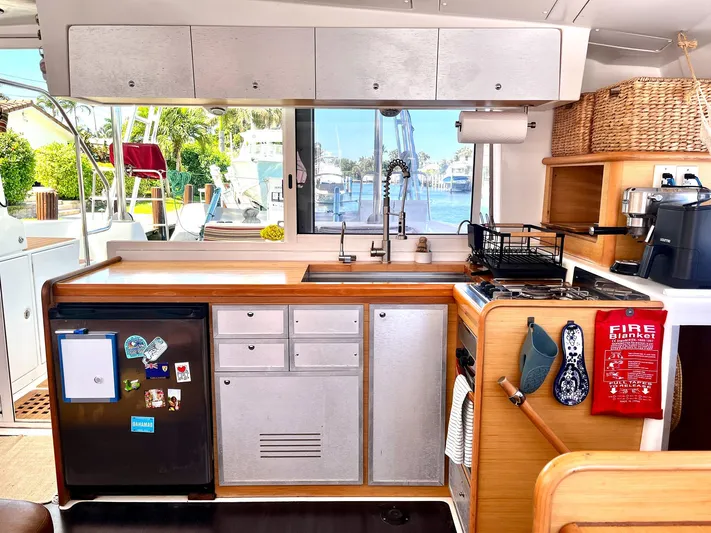  Yacht Photos Pics Modern kitchen interior of 2009 Lagoon 420 yacht with appliances and window view.