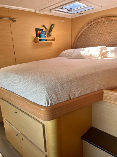  Yacht Photos Pics Luxurious bedroom interior of 2009 Lagoon 420 yacht with cozy bed and natural light.