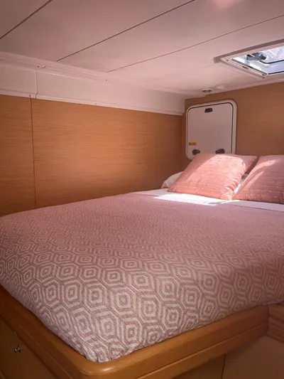  Yacht Photos Pics Cozy bedroom in 2009 Lagoon 420 yacht with soft lighting and elegant bedding.