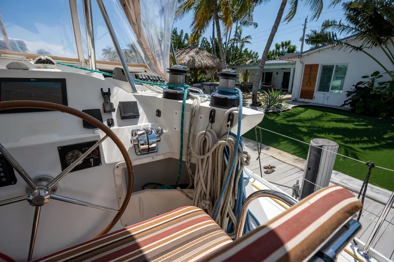  Yacht Photos Pics Cockpit of 2009 Lagoon 420 yacht with tropical background and palm trees.
