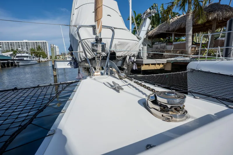  Yacht Photos Pics 2009 Lagoon 420 catamaran docked, showcasing deck and rigging under clear blue sky.