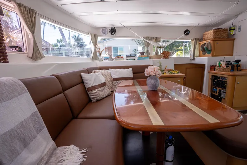  Yacht Photos Pics Luxurious interior of 2009 Lagoon 420 yacht with elegant seating and dining area.