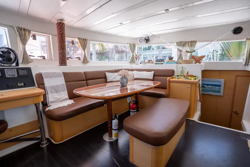  Yacht Photos Pics Interior of 2009 Lagoon 420 catamaran with cozy seating and dining area.