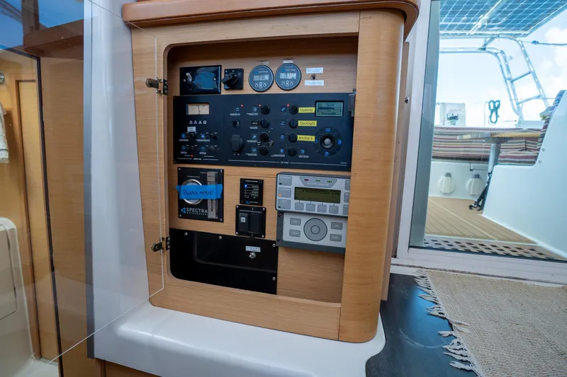  Yacht Photos Pics Control panel of a 2009 Lagoon 420 yacht, featuring various gauges and switches.