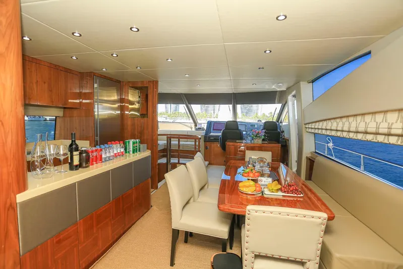  Yacht Photos Pics Luxurious interior of 2015 Sunseeker 75 Yacht with dining area and helm.