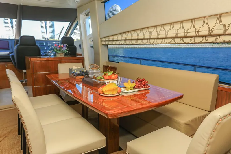  Yacht Photos Pics Luxurious interior of 2015 Sunseeker 75 Yacht with elegant dining area and scenic view.