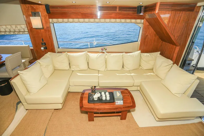  Yacht Photos Pics Luxurious interior of 2015 Sunseeker 75 Yacht with cream sofa and ocean view.