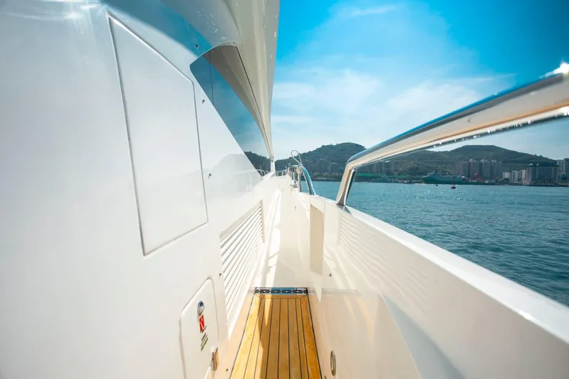  Yacht Photos Pics Side view of a 2015 Sunseeker 75 Yacht cruising on a sunny day.