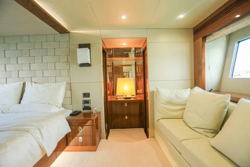  Yacht Photos Pics Luxurious interior of 2015 Sunseeker 75 Yacht with bed, sofa, and elegant lighting.