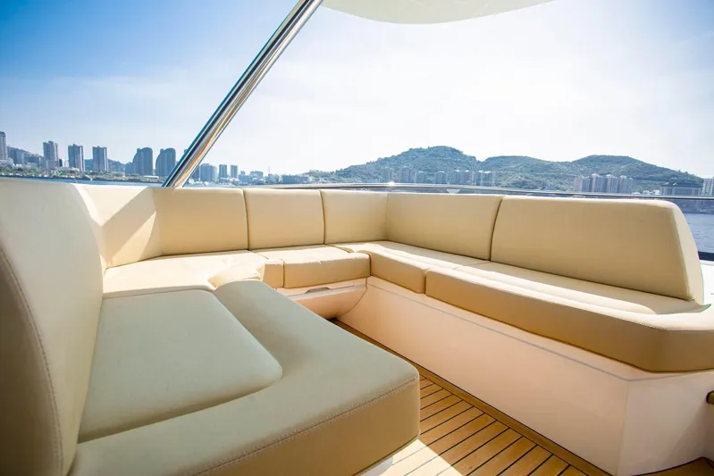  Yacht Photos Pics Luxurious seating area on 2015 Sunseeker 75 Yacht with scenic city and mountain views.