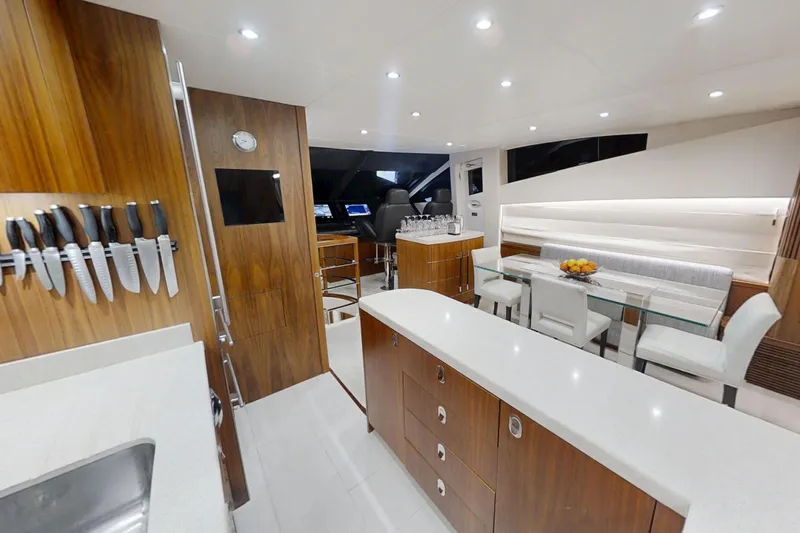 Glasax Yacht Photos Pics Luxurious interior of 2016 Sunseeker 75 Yacht with modern kitchen and dining area.
