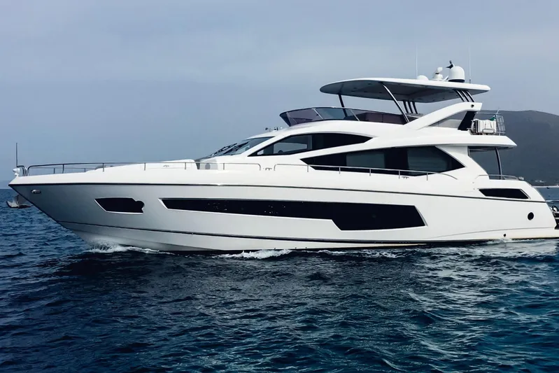 Glasax Yacht Photos Pics 2016 Sunseeker 75 Yacht cruising on open water, showcasing sleek design and luxury.