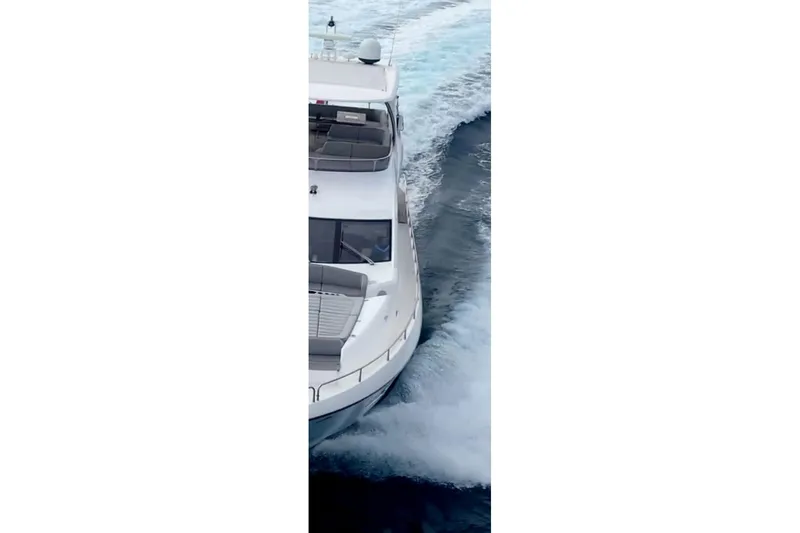 Glasax Yacht Photos Pics Sunseeker 75 Yacht 2016 cruising on open water, aerial view.