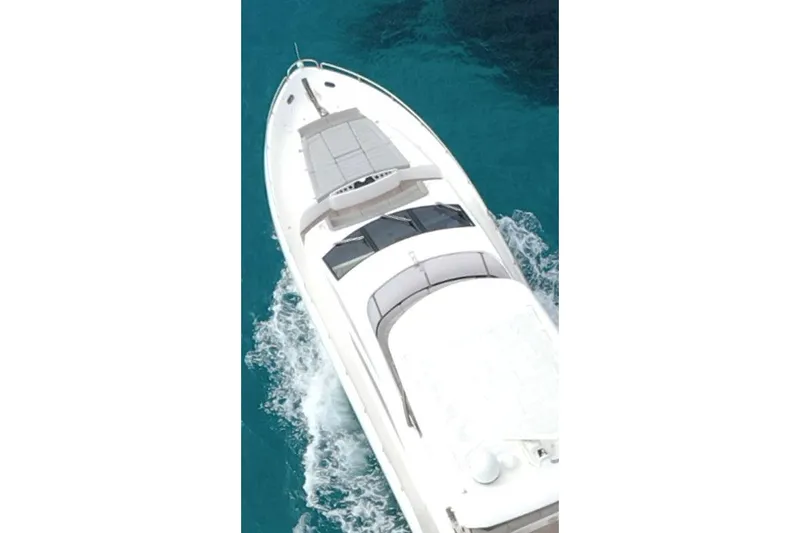 Glasax Yacht Photos Pics 2016 Sunseeker 75 Yacht cruising on clear blue water, aerial view.