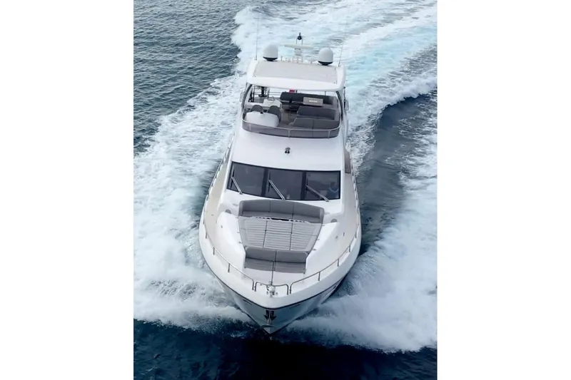 Glasax Yacht Photos Pics 2016 Sunseeker 75 Yacht cruising on open water, aerial view.