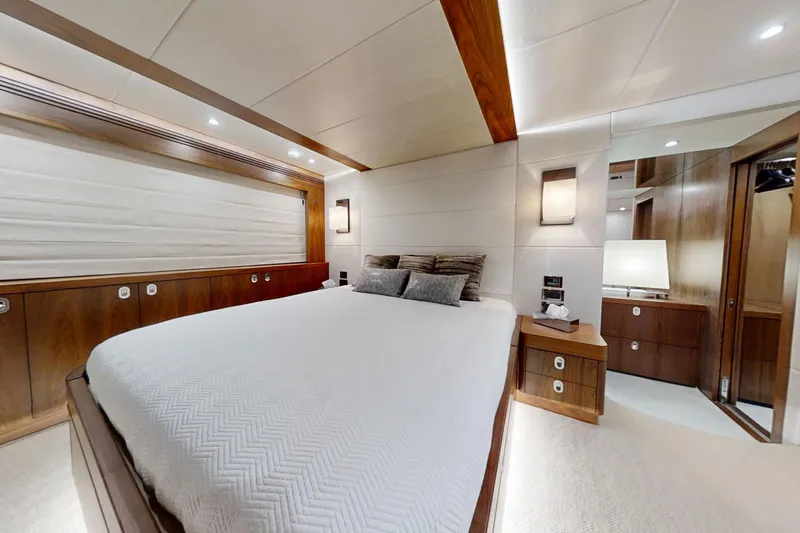 Glasax Yacht Photos Pics Luxurious bedroom interior of 2016 Sunseeker 75 Yacht with elegant wood finishes.