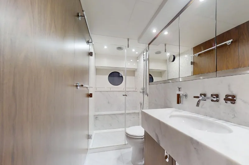 Glasax Yacht Photos Pics Luxurious bathroom interior of 2016 Sunseeker 75 Yacht with marble finishes and modern fixtures.