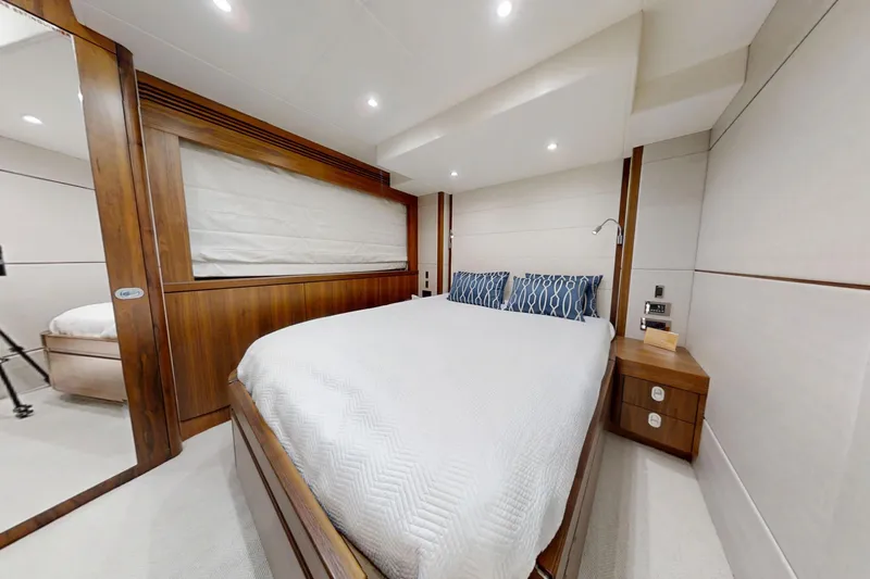 Glasax Yacht Photos Pics Luxurious bedroom interior of 2016 Sunseeker 75 Yacht with modern design and cozy ambiance.