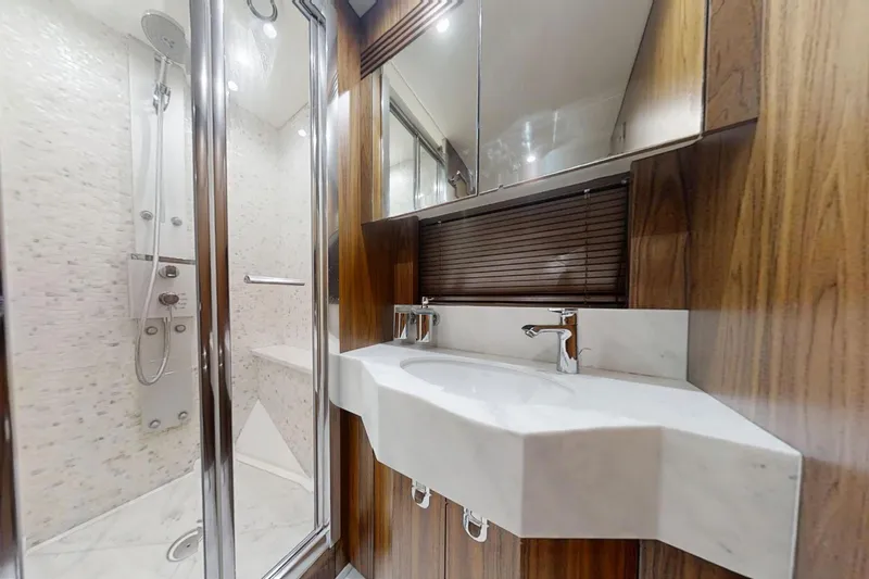 Glasax Yacht Photos Pics Luxurious bathroom in 2016 Sunseeker 75 Yacht with modern shower and elegant sink.