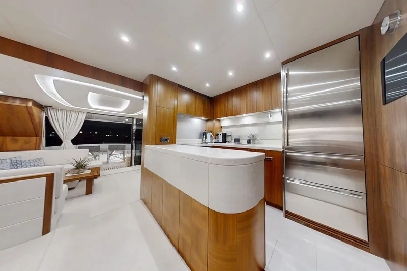 Glasax Yacht Photos Pics Luxurious interior of 2016 Sunseeker 75 Yacht featuring modern kitchen and elegant seating area.