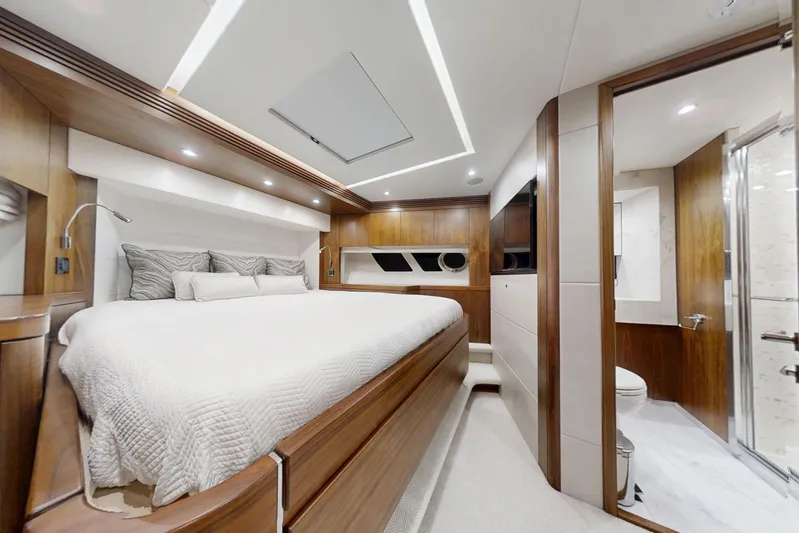 Glasax Yacht Photos Pics Luxurious bedroom interior of 2016 Sunseeker 75 Yacht with modern wood finishes.