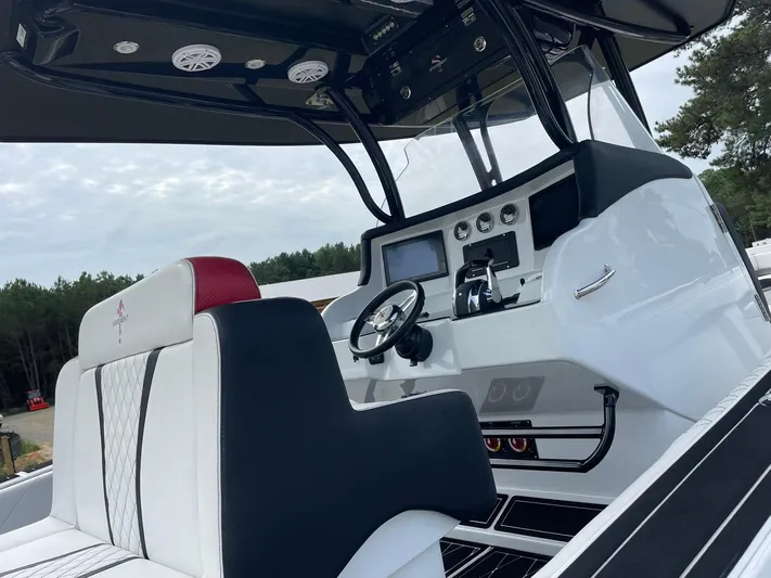  Yacht Photos Pics Interior view of 2018 Statement 35 CC boat, featuring modern helm and seating.