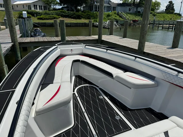 Yacht Photos Pics Luxurious 2018 Statement 35 CC boat with sleek seating at a dock.