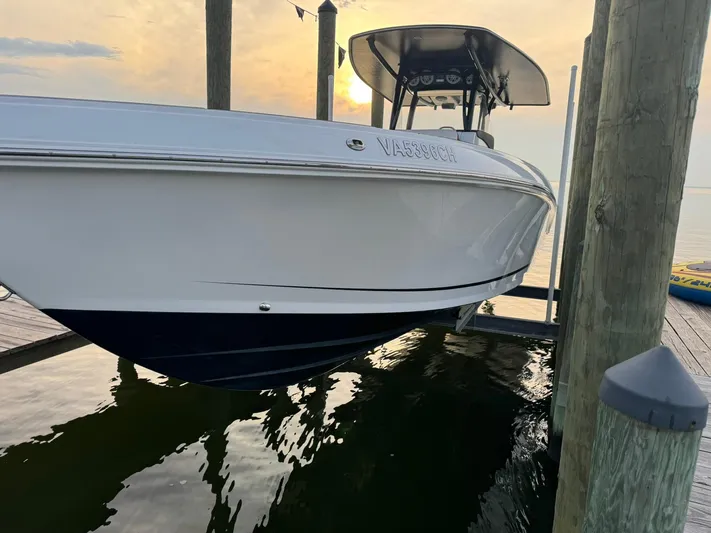  Yacht Photos Pics 2018 Statement 35 CC boat docked at sunset, reflecting on calm water.